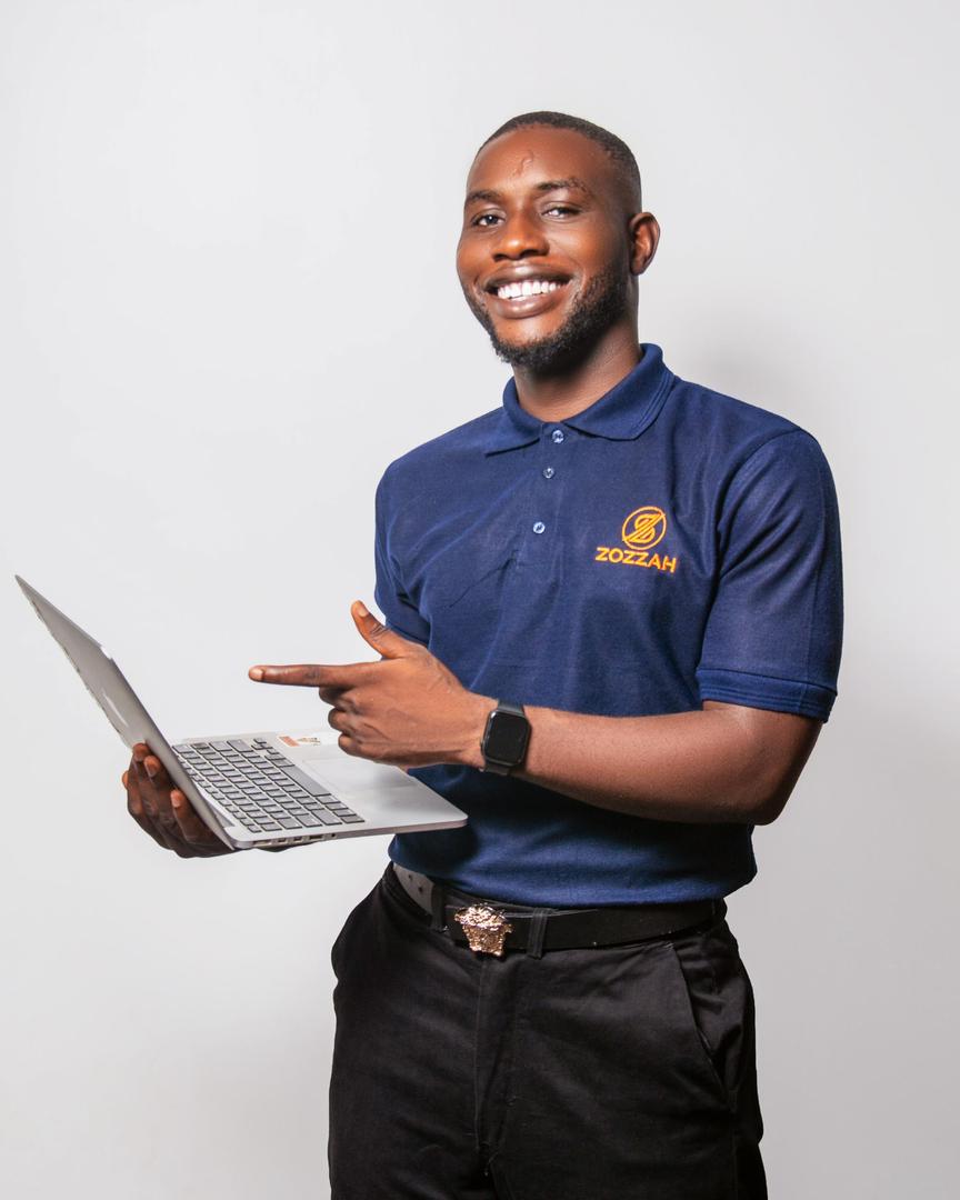 Working professional building a side hustle on a laptop after hours